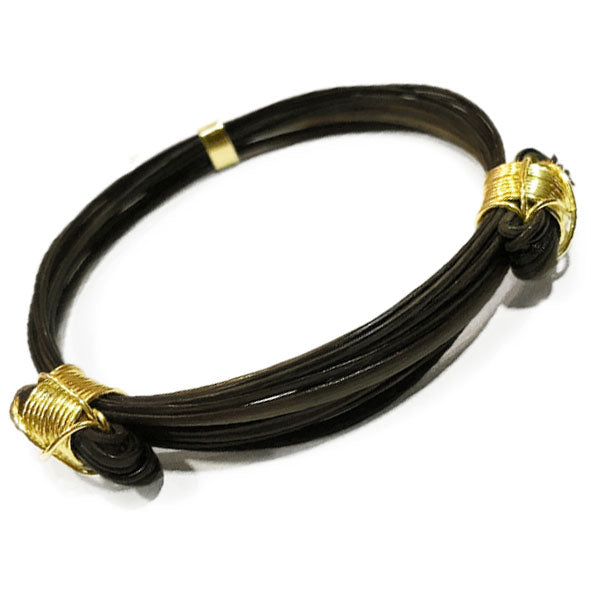 Pulsera de pelo de búfalo africano con nudos corredizos y oro amarillo 18 kilates - Joyas de Caza