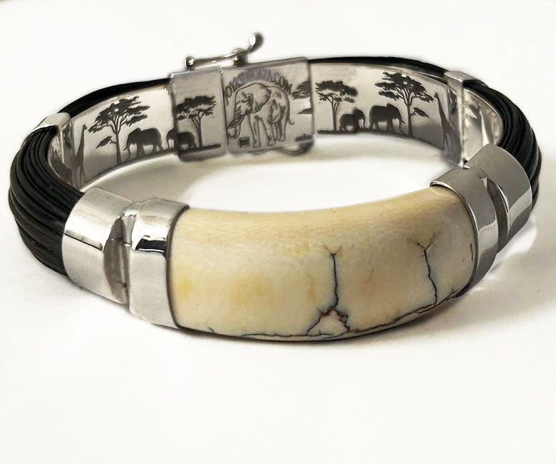 pulsera-ancha-media-cana-pelo-bufalo-con-colmillo-en-plata-de-ley