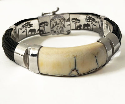pulsera-ancha-media-cana-pelo-bufalo-con-colmillo-en-plata-de-ley